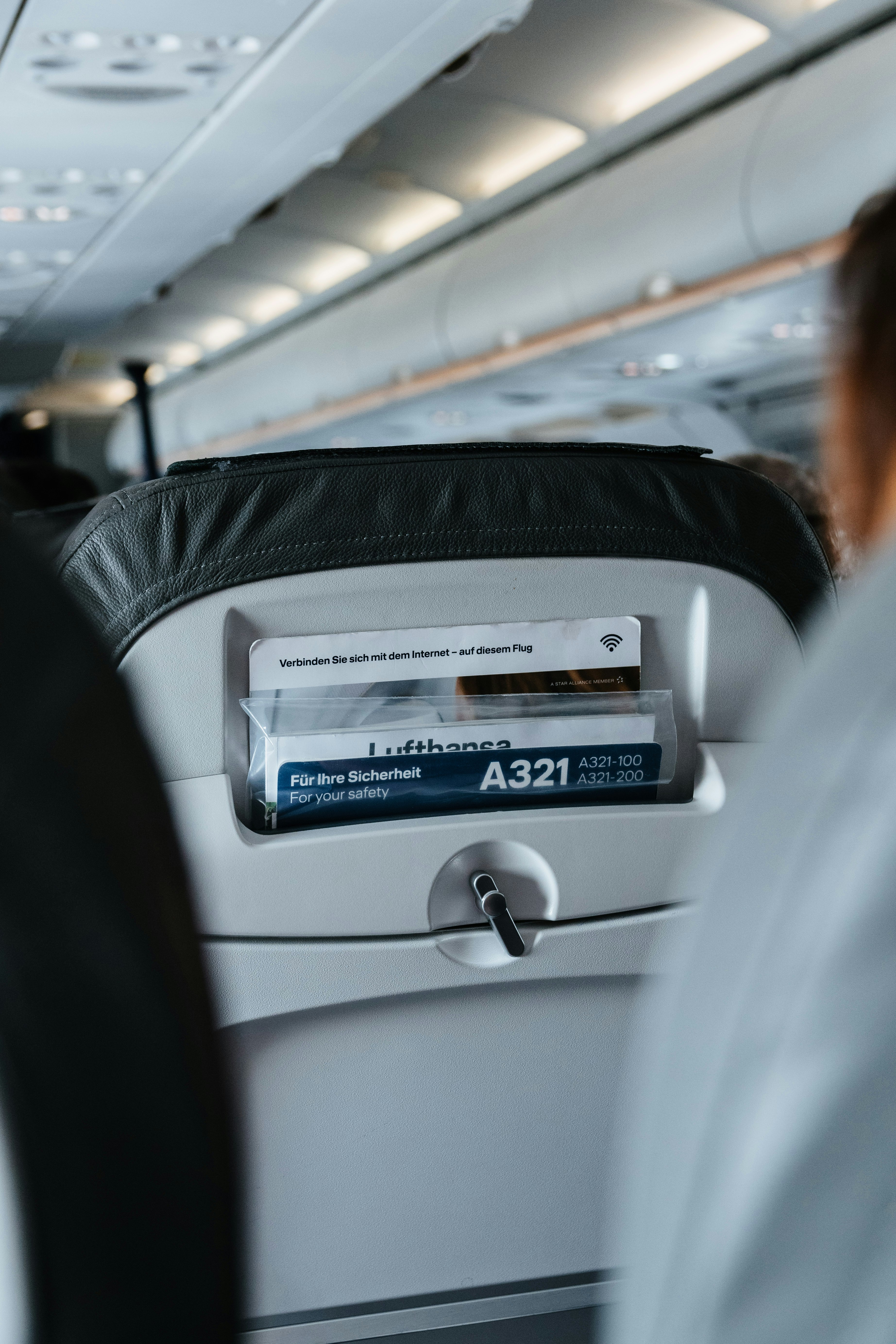 person sitting inside airplane